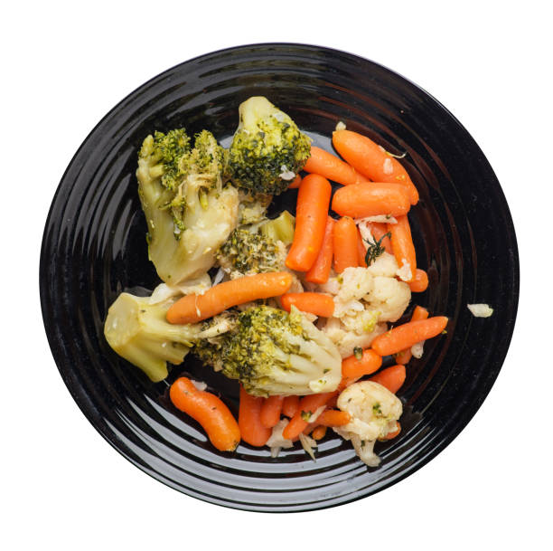 istock provencal vegetables on a plate.grilled vegetables on a plate isolated on white background.broccoli and carrots on a plate top view.healthy  food 1163728197