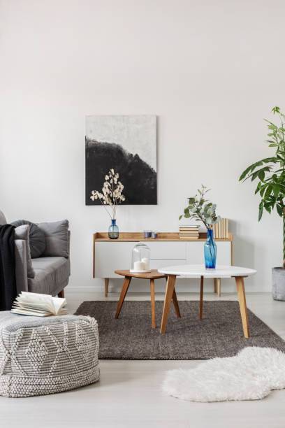 istock Grey scandinavian sofa in bright living room interior 1163729202