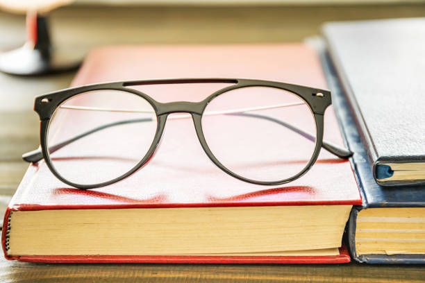 istock Close up Eye glasses and books 1163729503
