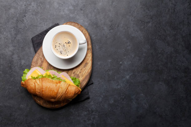 istock Coffee and croissant sandwich 1163730322