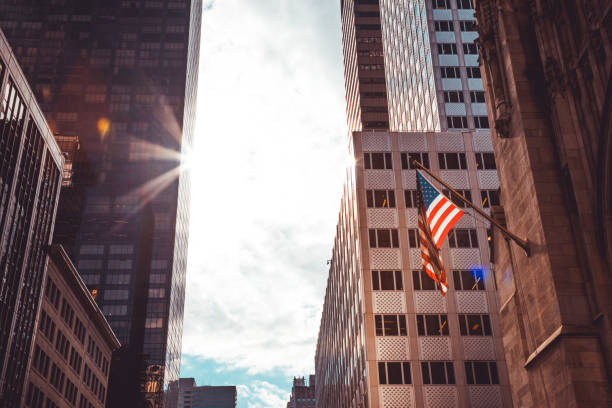 istock American Flags Against Office Building 1163730527