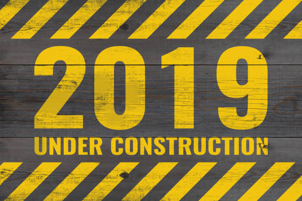 istock 2019 under construction warning message painted on aged wooden planks 1163730719