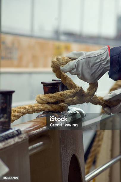 Workers Hands Tying Up A Boat To The Dock Stock Photo - Download Image Now - Passenger Ship, Tied Knot, Tying