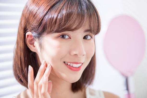 istock Young asian woman look mirror 1163733879