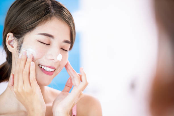 istock beauty woman clean her face 1163735501