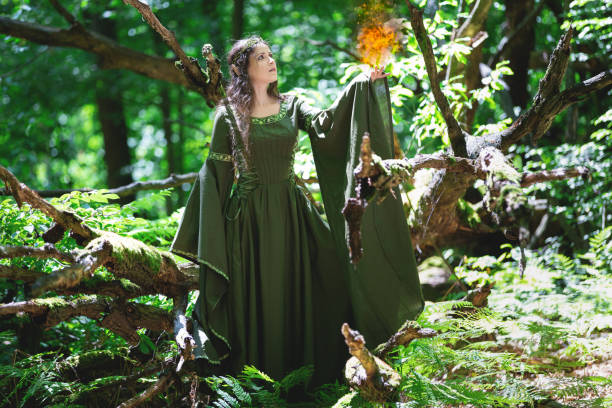 istock Elf with the element of fire in the forest 1163737174
