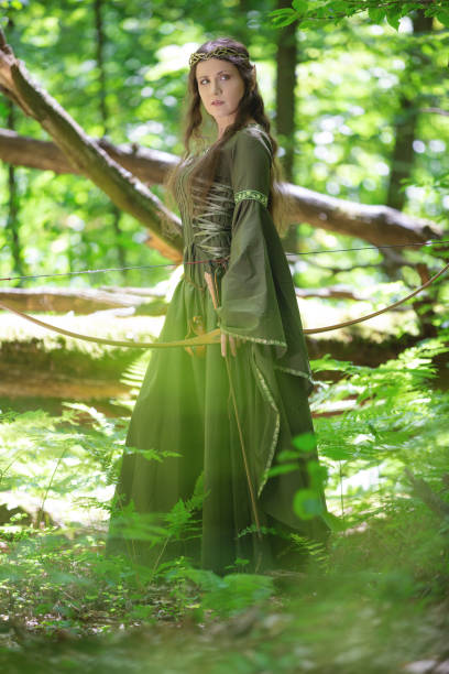 istock Elf archer with a bow in the forest 1163737181