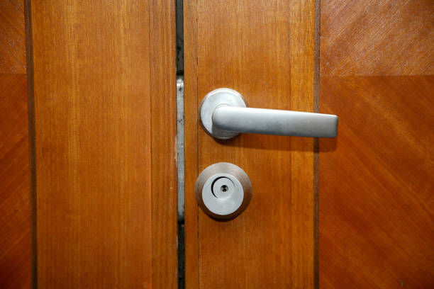 istock Door Handle and Lock on Wooden Door 1163738274