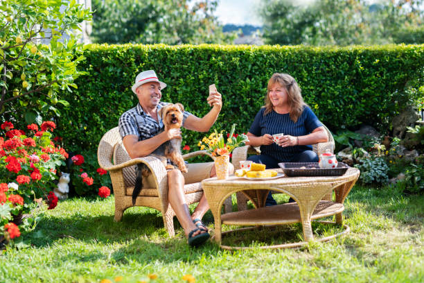 istock Mature couple making selfie in garden. 1163739459