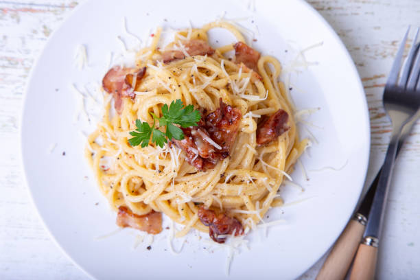 istock Pasta carbonara with bacon, cheese and parsley. 1163739477