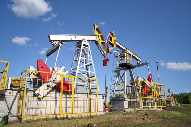 istock Oil pump, field, blue sky 1163739941