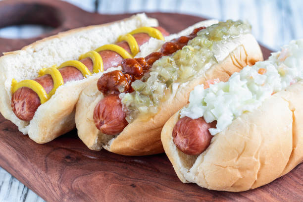 istock Three varieties of hot dogs over a cutting board 1163743694