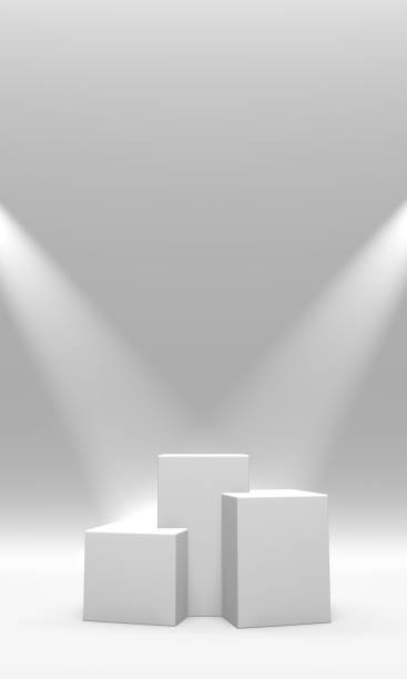 istock Podium, pedestal or platform white color illuminated by spotlights on white background. Abstract illustration of simple geometric shapes. 3D rendering. 1163746233
