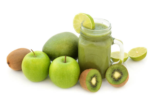 Fruit juice smoothie health drink with mango, lime, kiwi and apple on white background. High in antiioxidants, vitamins and dietary fibre.