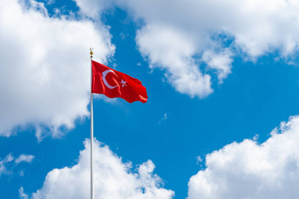 istock Turkish Flag in Front of Clouds 1163749065