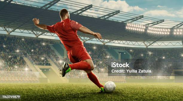 Soccer Player Kicks A Ball Stock Photo - Download Image Now - Soccer, Soccer Ball, Soccer Player