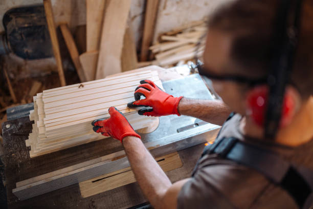 istock Master woodworker cutting wood stick stock photo 1163750155