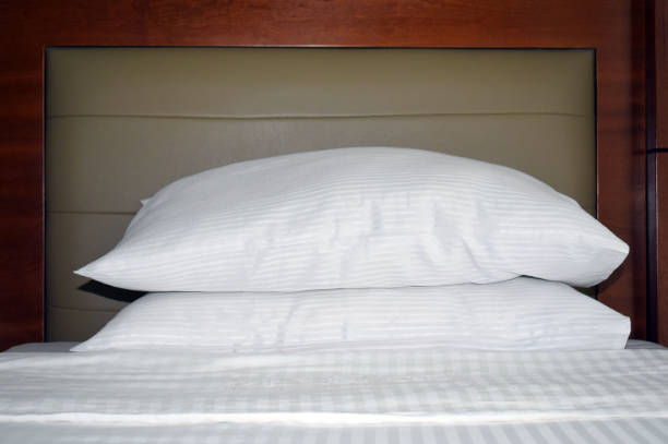 istock White bed sheets and pillows. Interior of a luxury double bed hotel bedroom. 1163755161