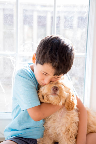 istock Puppy and a little Boy 1163760881