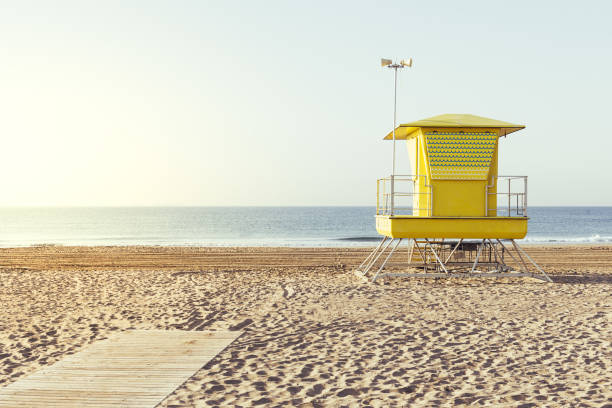 istock Yellow lifeguard house on the beach 1163761290