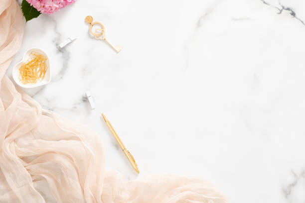 istock Stylish composition with pink hydrangea flower, pastel blanket and golden accessories on marble background. Flat lay, top view beauty blogger workspace. 1163764109