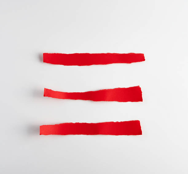 istock torn strips of red paper on white background 1163765512