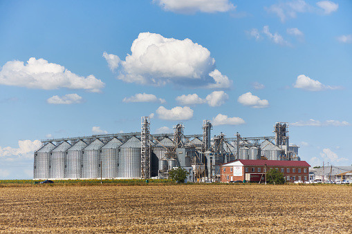 Novonikolaevskaya, Krasnodar Region, Russia, July 01, 2019: Modern processing complex of grain crops on background of blue sky