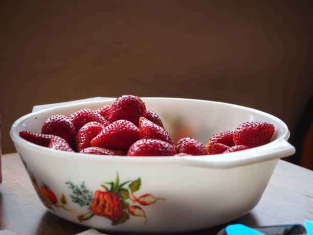 istock Plate full of ripe red strawberries 1163767168