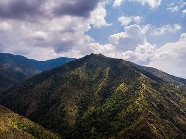 istock Aerial view of mountain and forest, cloudy day 1163767484