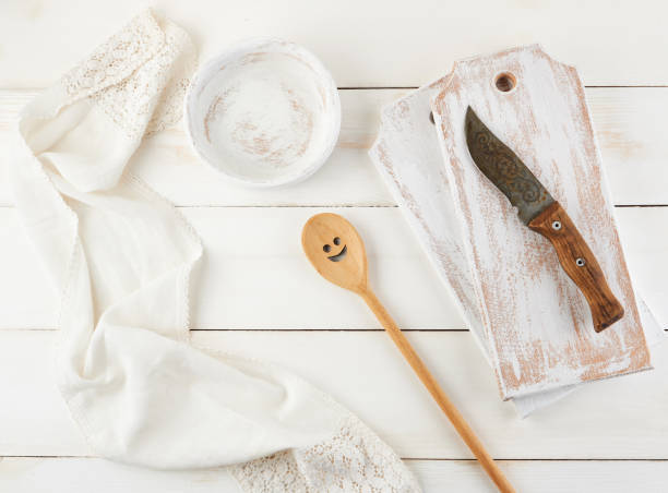 istock wooden spoon, plate, knife and a cutting board 1163768160