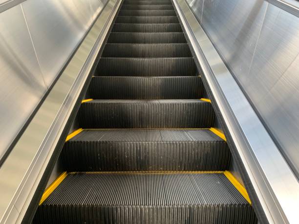 istock Modern escalator electronic system moving,  metal line steel 1163768206