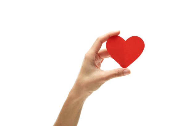 istock Woman Holding Heart Shape Over White Background 1163768346