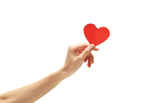 istock Woman Holding Heart Shape Over White Background 1163770245