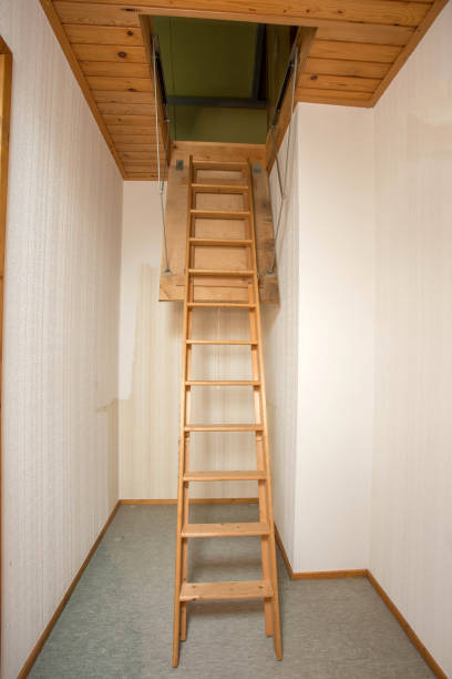 Wooden folding ladder to the attic, old empty house Wooden folding ladder to the attic, old empty house close-up interior of old house garret stock pictures, royalty-free photos & images