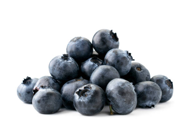 istock Heap of ripe blueberries close-up on a white. Isolated. 1163772032