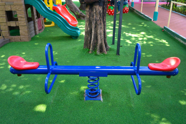 istock Blank blue teeterboard on the kids playground in garden 1163772343