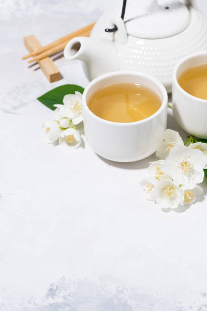 istock japanese tea ceremony. green tea with jasmine, vertical 1163773518
