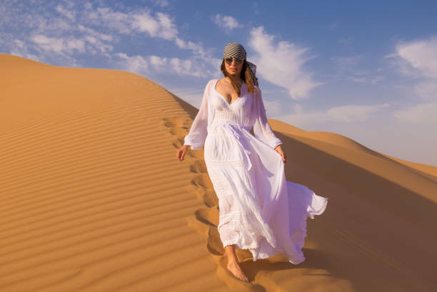 istock UAE. Woman in desert 1163773635