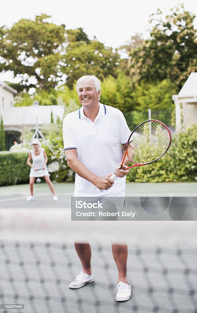 Senior couple playing tennis  Tennis Stock Photo