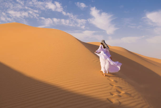istock UAE. Woman in desert 1163774651