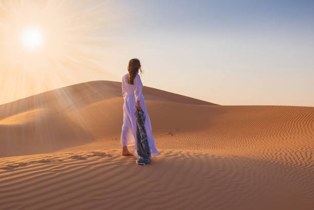 istock UAE. Woman in desert 1163775043