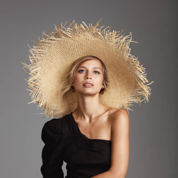 istock Beautiful woman wearing straw hat 1163776244