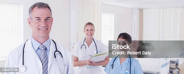 Doctors And Nurse In Hospital Stock Photo - Download Image Now - Doctor, Smiling, 18-19 Years