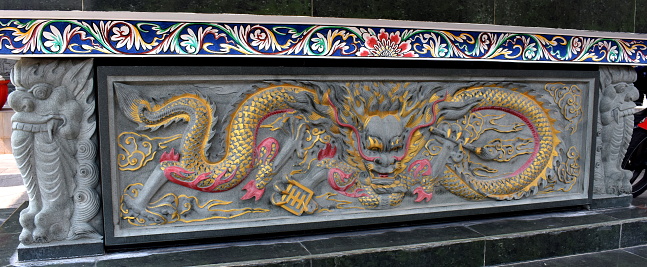 Stone carved dragon on shrine at a Chinese temple