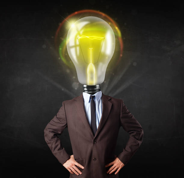 istock Business man with light bulb head concept 1163779303