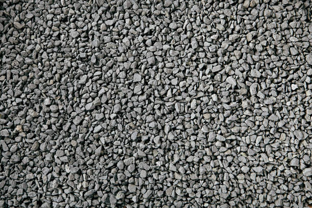 istock Natural Gray Granite Chippings, Macadam, Rubble or Crushed Stones Background Top View 1163779529