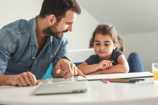 istock Father teach his daughter to draw. 1163779986