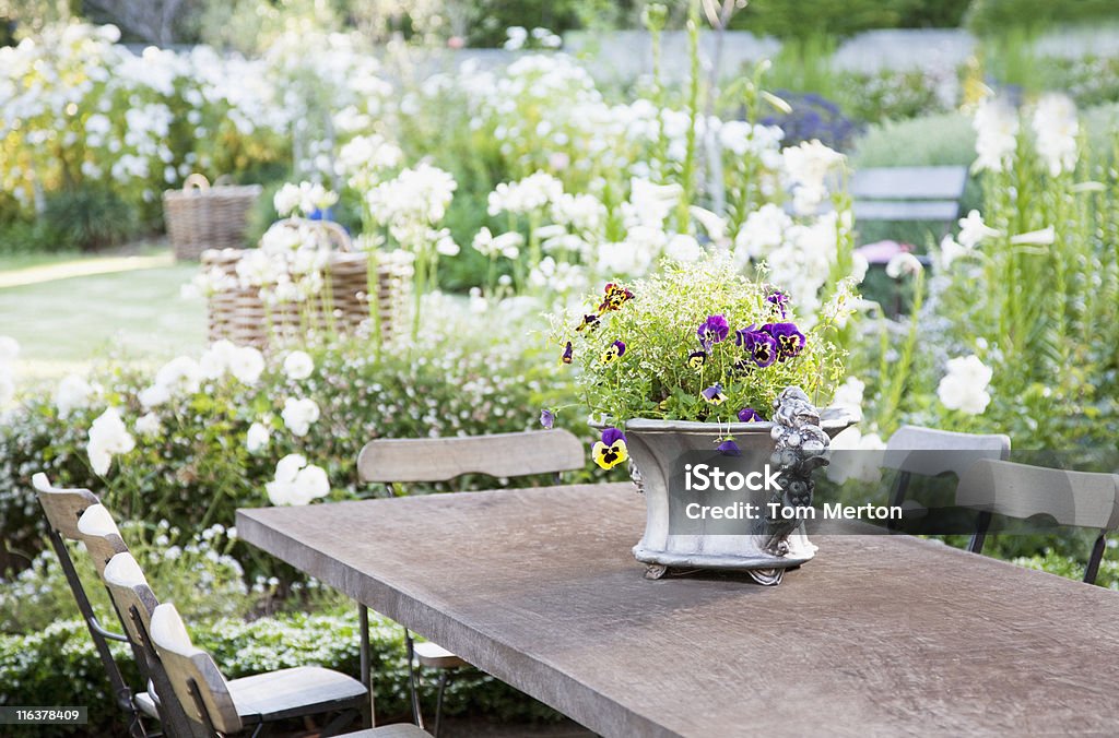 Flowerpot on garden table  Yard - Grounds Stock Photo