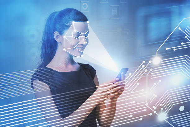 istock Smiling woman with phone, face recognition 1163784098