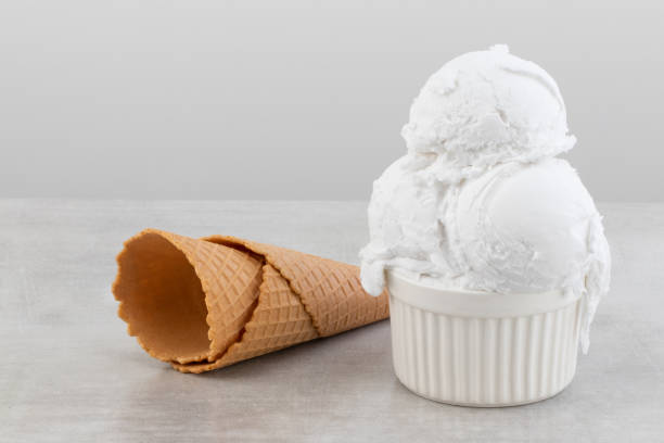 istock plate of vanilla ice cream scoops and waffle cones 1163784195